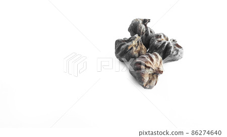 Isolated dried brown teak seeds on white background Isolated dried brown teak seeds on white background 86274640