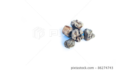 Isolated dried brown teak seeds on white background Isolated dried brown teak seeds on white background 86274743