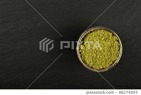 Bowl of ground unroasted raw green coffee Bowl of ground unroasted raw green coffee 86274893