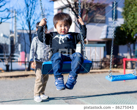 A swing for a child playing in the park 86275043