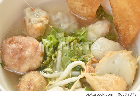 boiled Hakka meatball made from chop pork stuffing fried tofu with bean sprout and lettuce in soup on bowl 86275375