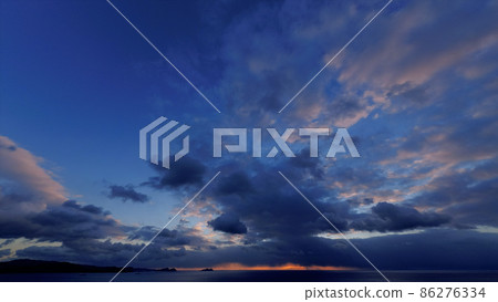 Dynamic landscape created by winter sky and sea, sunset and clouds, super wide angle 86276334