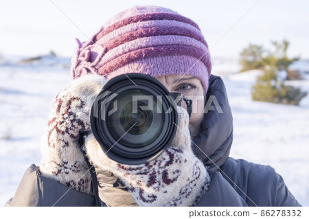 portrait of a photographer with a camera on his face portrait of a photographer with a camera on his face 86278332