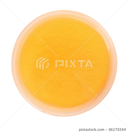 Orange slime in plastic container isolated on white, top view. Antistress toy Orange slime in plastic container isolated on white, top view. Antistress toy 86278569