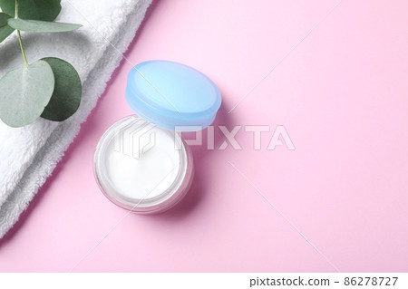 Open jar of cream on pink background, flat lay. Space for text Open jar of cream on pink background, flat lay. Space for text 86278727