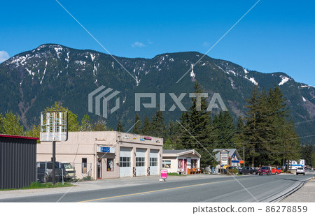 Street of small canadian town on snow mountain and blue sky background Street of small canadian town on snow mountain and blue sky background 86278859