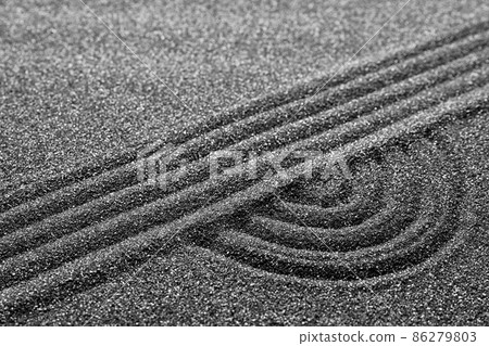 Pattern on decorative black sand, closeup. Zen and harmony 86279803