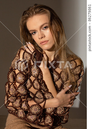 Pretty blond woman in sunset light Pretty blond woman in sunset light 86279861