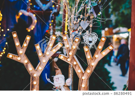 Reindeer antlers with lights on Christmas outdoor market Reindeer antlers with lights on Christmas outdoor market 86280491