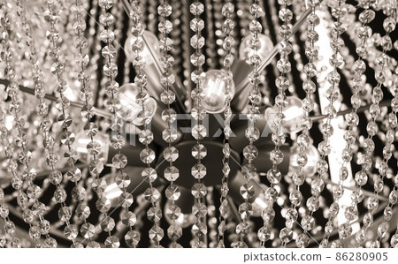 Luxury ceiling crystal chandelier in hotel close-up Luxury ceiling crystal chandelier in hotel close-up 86280905