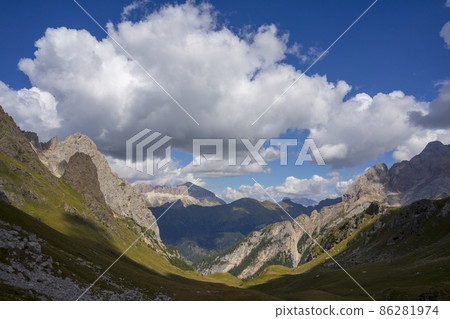 View from the Lino Pederiva mountain trail to Colac and Sella Group. Dolomites. View from the Lino Pederiva mountain trail to Colac and Sella Group. Dolomites. 86281974