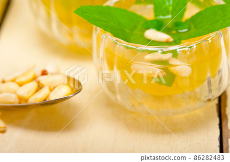 Arab traditional mint and pine nuts tea Arab traditional mint and pine nuts tea 86282483