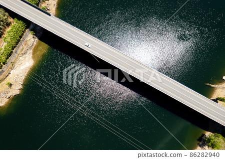 Bridge across reservoir, aerial shot. Spain Bridge across reservoir, aerial shot. Spain 86282940