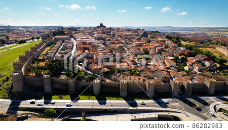 Drone point of view Avila cityscape rooftops. Spain 86282983