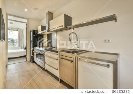 Cozy well designed modern kitchen interior with all appliances 86285285