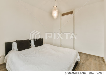 Beautiful bedroom in new luxury home with some decor Beautiful bedroom in new luxury home with some decor 86285289