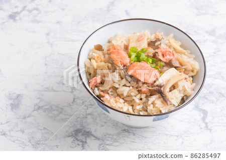 Cooked rice with salmon and mushrooms 86285497