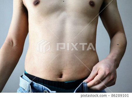 A man who is fat and can't fit his pants A man who is fat and can't fit his pants 86289101