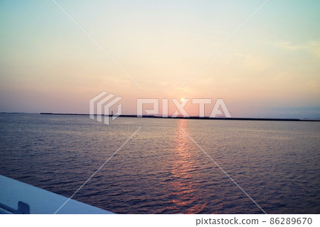 The sunset over the sea is purple blue pink The sunset over the sea is purple blue pink 86289670