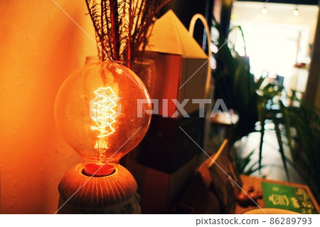 Tungsten lamp with warm yellow light Tungsten lamp with warm yellow light 86289793