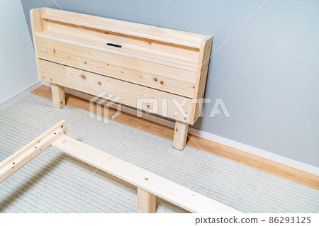 A photo of assembling a bed purchased online. DIY image. A photo of assembling a bed purchased online. DIY image. 86293125