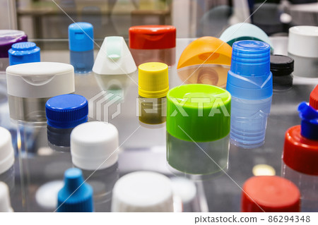 different colors of plastic lids and containers of different shapes and purposes different colors of plastic lids and containers of different shapes and purposes 86294348