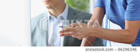 Young man communicates with colleague and is studying business strategies on computer closeup 86296346