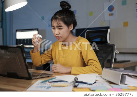 Picture of angry overworked young woman in home office. Picture of angry overworked young woman in home office. 86297773