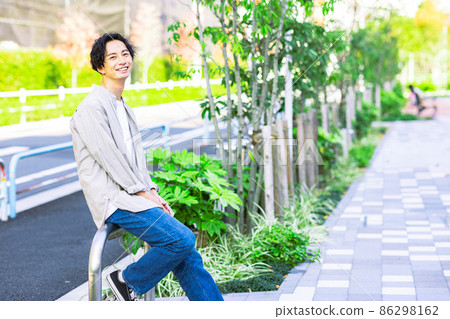 Image of a man relaxing outside 86298162