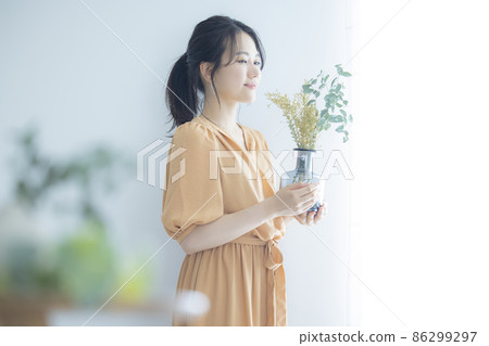 Woman in a beige dress 86299297