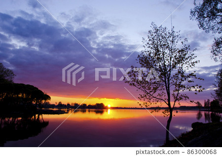 beautiful lake sunset in spring time beautiful lake sunset in spring time 86300068
