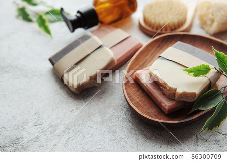 Handmade soap bars and green leaves Handmade soap bars and green leaves 86300709