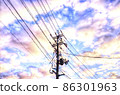 Electric poles and electric wires stretched over the bright sunrise sky 86301963