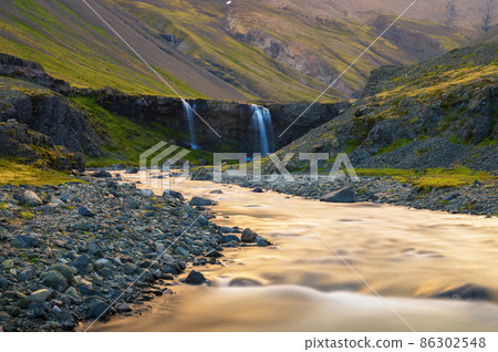 Skutafoss waterfalls near Hofn in Iceland photographed at sunset Skutafoss waterfalls near Hofn in Iceland photographed at sunset 86302548