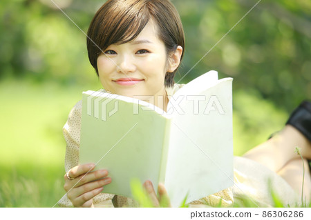 A woman reading A woman reading 86306286