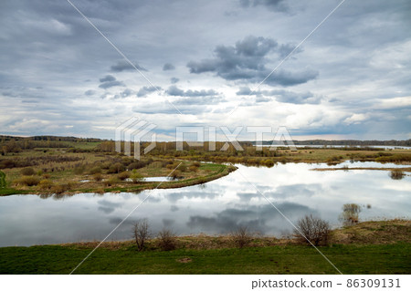 Sorot river under cloudy sky, Russia 86309131