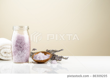Lavender bath salt in a glass jar with flowers 86309205