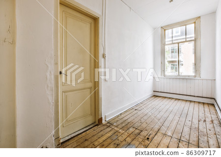 An exciting design of a room with large windows and a door An exciting design of a room with large windows and a door 86309717