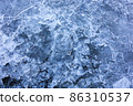 Abstract ice background. Blue background with cracks on the ice surface 86310537