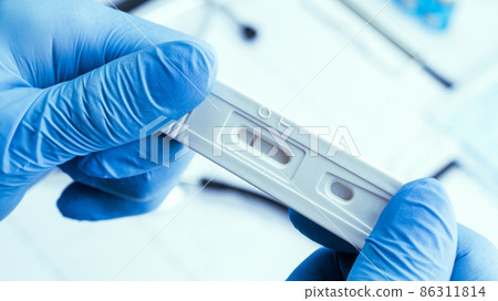 Antigen test antigen coronavirus kit. Laboratory hospital lab background. Doctor holding rapid covid medical test. Patient fast swab serology antibody specimen sample. Antigen test antigen coronavirus kit. Laboratory hospital lab background. Doctor holding rapid covid medical test. Patient fast swab serology antibody specimen sample. 86311814