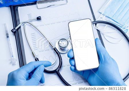 Cellphone mockup. Syringe with needle, hospital healthcare charts, doctor stethoscope and black smartphone with blank screen for medical equipment background with clipping path, copy space. Cellphone mockup. Syringe with needle, hospital healthcare charts, doctor stethoscope and black smartphone with blank screen for medical equipment background with clipping path, copy space. 86311828