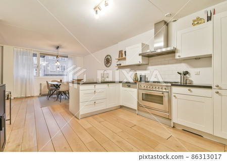 Cozy well designed modern kitchen interior with all appliances Cozy well designed modern kitchen interior with all appliances 86313017