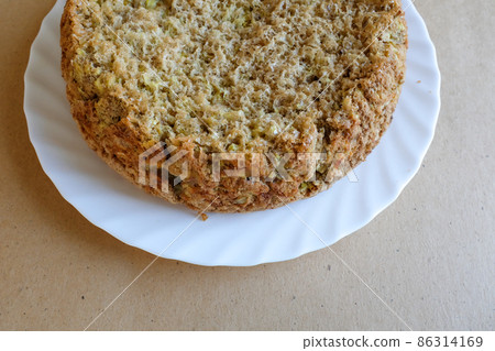 Apple pie on a white plate, top view. Homemade bakery. Culinary template. Charlotte pie for publication, design, poster, calendar, post, screensaver, wallpaper, postcard, card, banner, cover, website Apple pie on a white plate, top view. Homemade bakery. Culinary template. Charlotte pie for publication, design, poster, calendar, post, screensaver, wallpaper, postcard, card, banner, cover, website 86314169