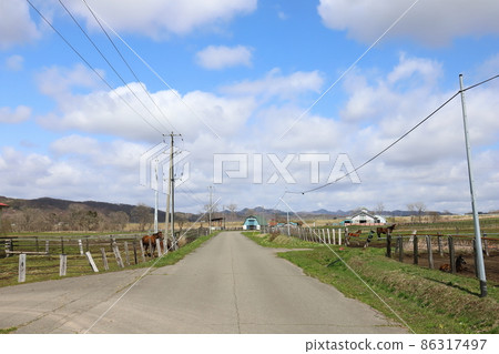 Scenery with a farm in the Hidaka region of Hokkaido Scenery with a farm in the Hidaka region of Hokkaido 86317497