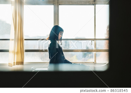 High school girl standing in the classroom after school 86318545