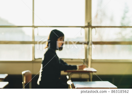 Female student studying in the classroom [blurred image] 86318562