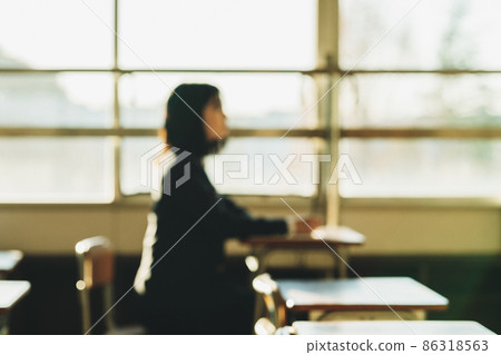 Female student studying in the classroom [blurred image] 86318563