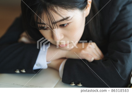 School girls lying on the desk 86318583
