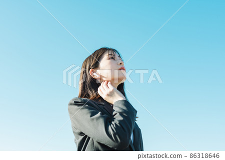 High school girl listening to music with earphones 86318646