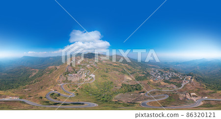 360 panorama by 180 degrees angle seamless panorama of aerial view of cars driving on curved, zigzag curve road or street on mountain hill in rural area of Nan, Thailand. Transportation. 86320121